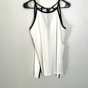 Sleeveless top. Beautiful white & black. A classic style. Loose fit. Sz M